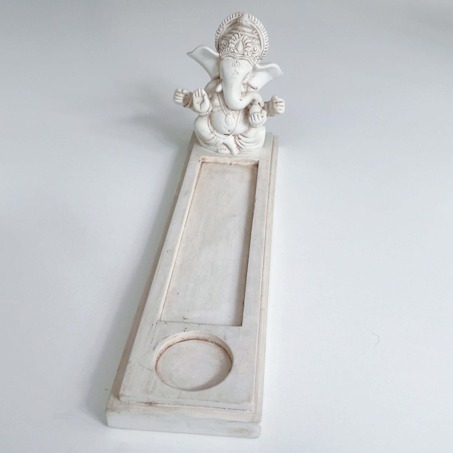 Top view of incense holder, Ganesha sits at one end of long rectangle, the remaining part is to catch the ash.