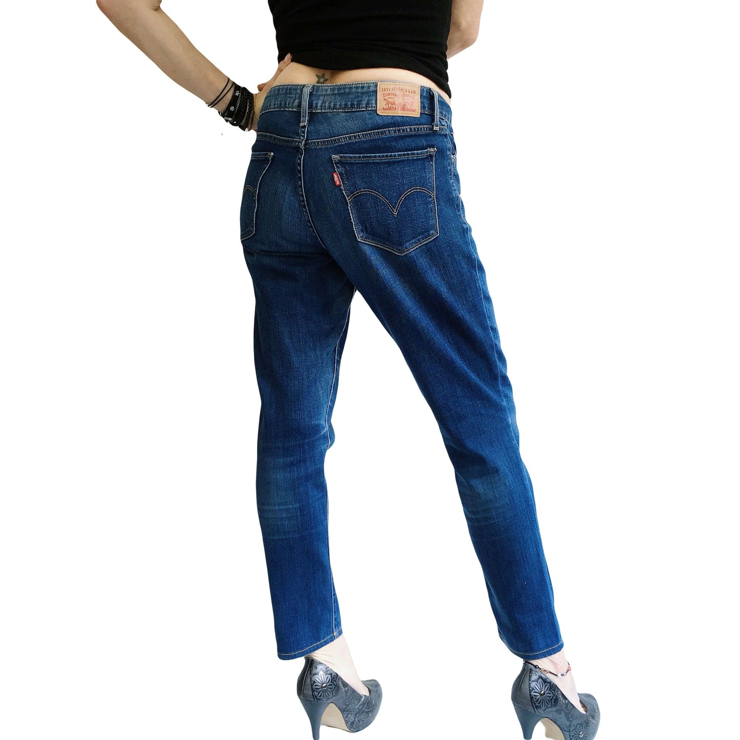 Back view of blue jeans, uniform coloration.