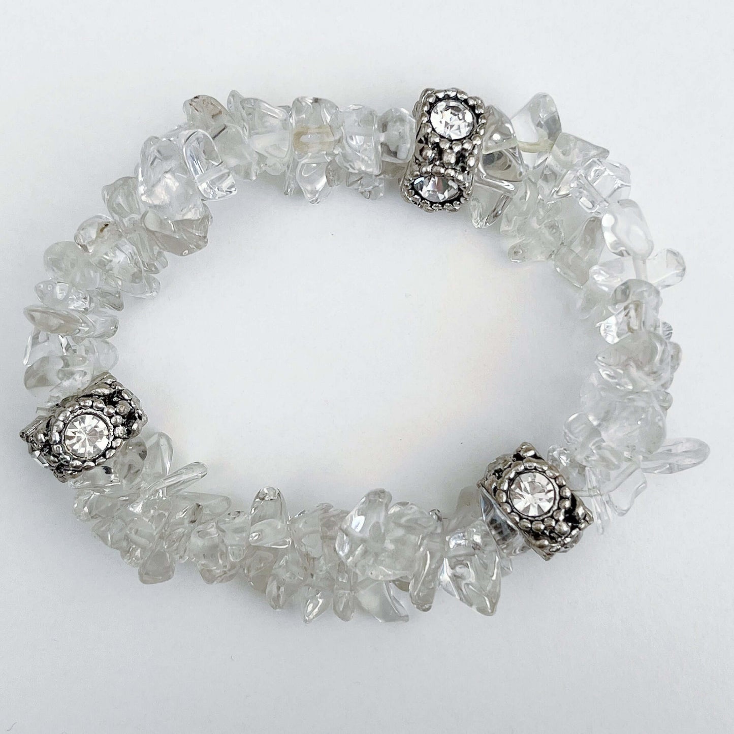 Top view of double strand tumbled chip bracelet, with a diamante and silver finish bead positioned in 3 places.