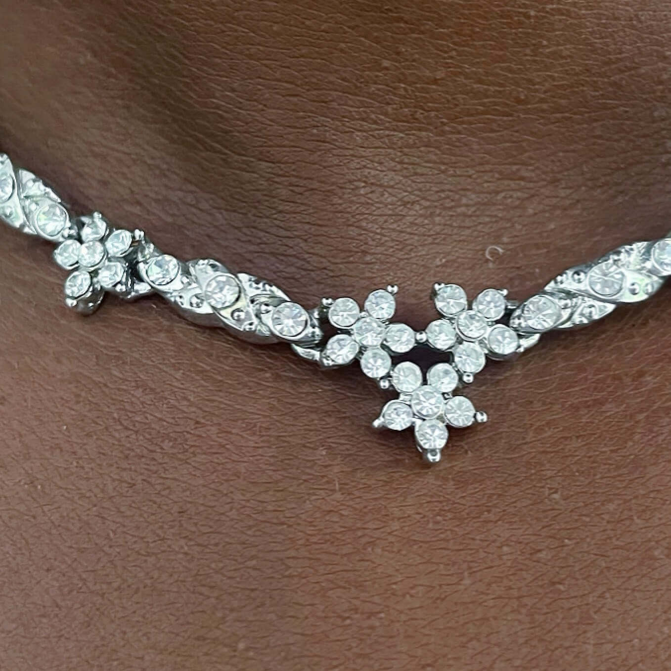 Detail of central flower station on necklace.