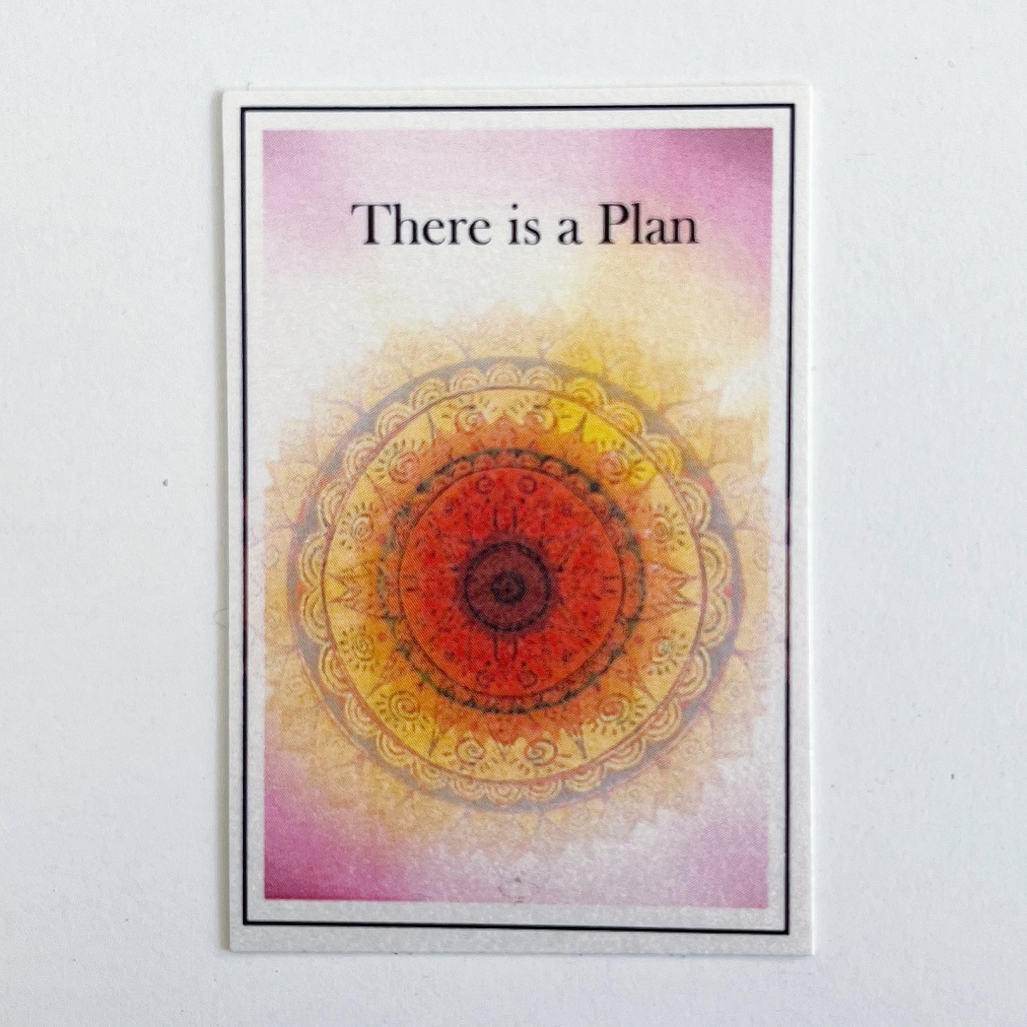 Red and orange sample card which reads " there is a plan"