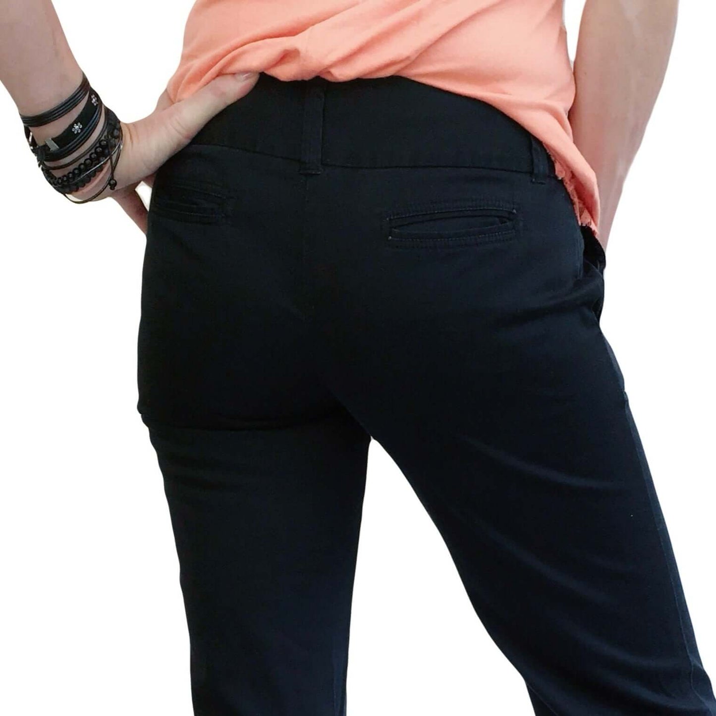 Back detail view of pants, wide waist band, with loops and two narrow slit pockets.
