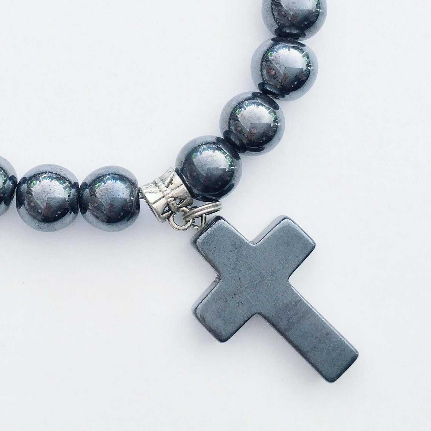 Detail view of beaded bracelet with matching Hematite cross.