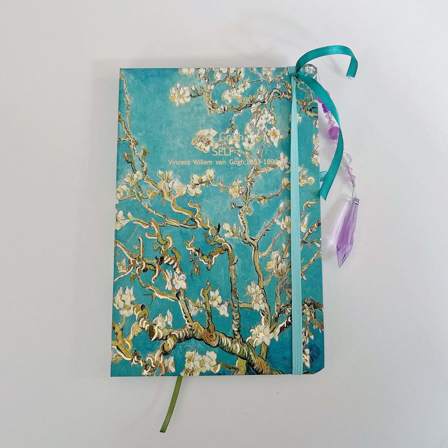 Top view of journal showing both the elasticated book mark and the beaded one.