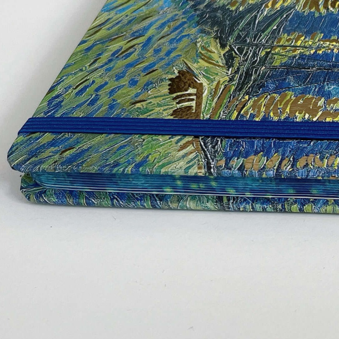 Side view of the journal, showing the facing pages also printed with artwork.