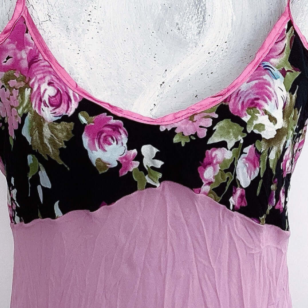 Close up of black, pink and green rose floral printed bust area.