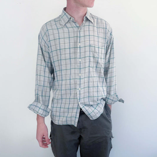 Front view of the shirt, classic button down style, pic shown with the sleeves rolled up on the model.