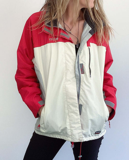 Front view of jacket, with red shoulders and sleeves, below which is all white.