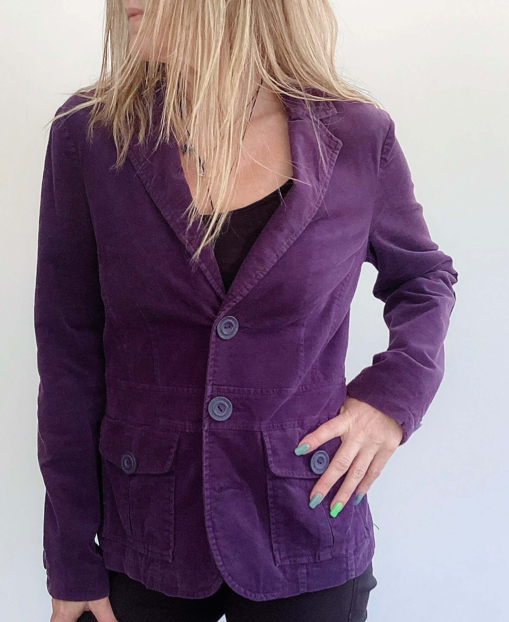 Front view of dark purple single breasted corduroy blazer.