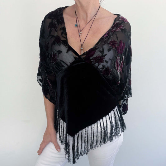 Front view of top, burn-out silk bodice with V neck, and velvet torso with black fringing on the v shaped hem front and back.