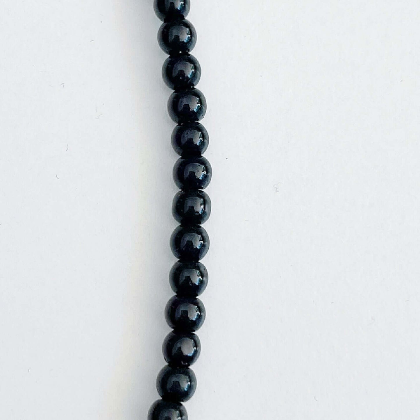 Detail view of the smooth Obsidian beads.