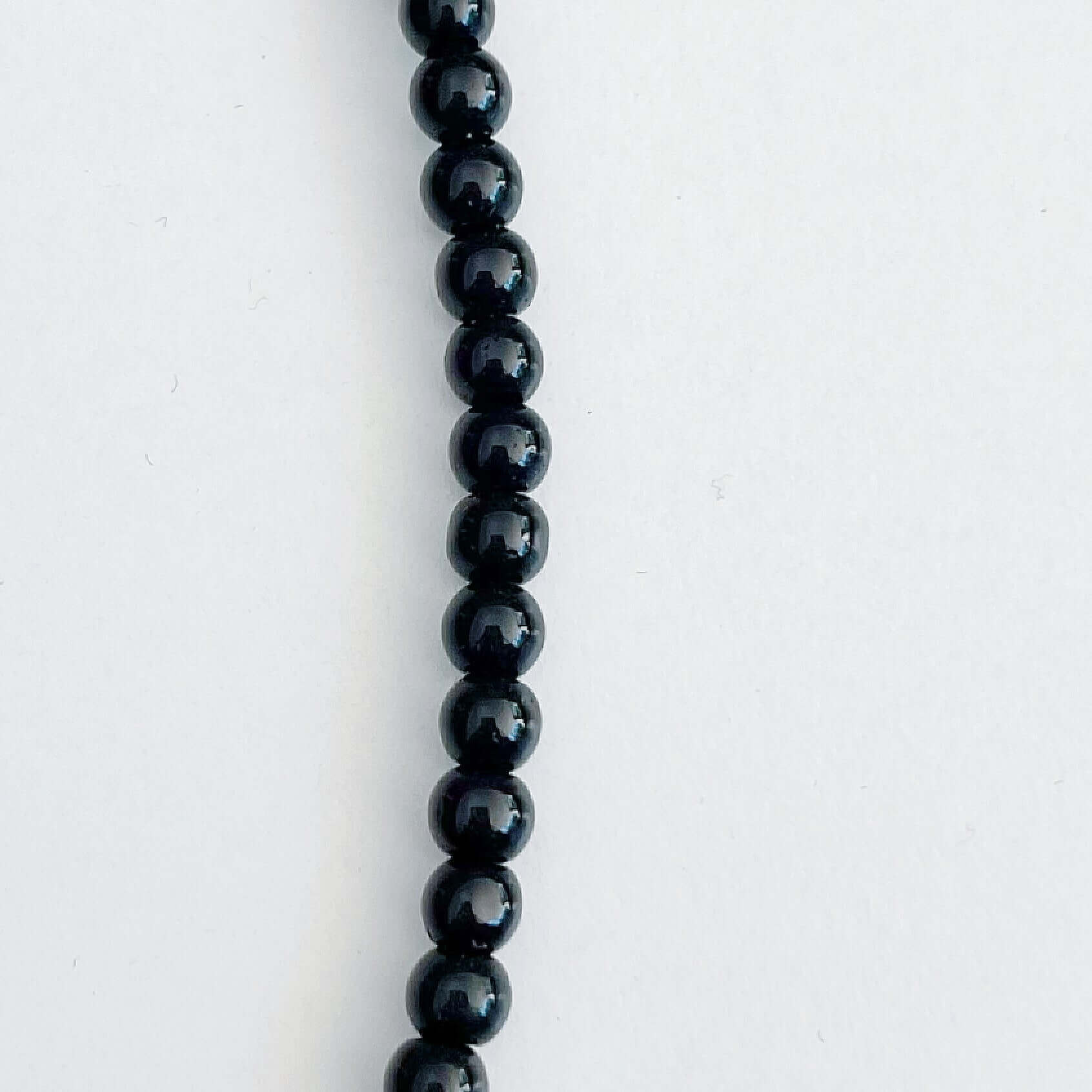 Detail view of the smooth Obsidian beads.