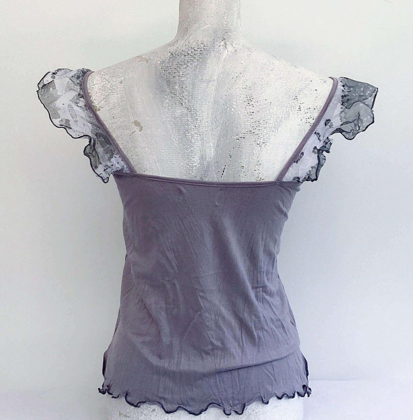 Back view of camisole, showing contrasting, patterned, wide chiffon frill straps.