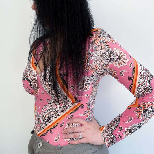 Back view of lycra top, very detailed floral and geometric print, in pink, orange, brown and white.