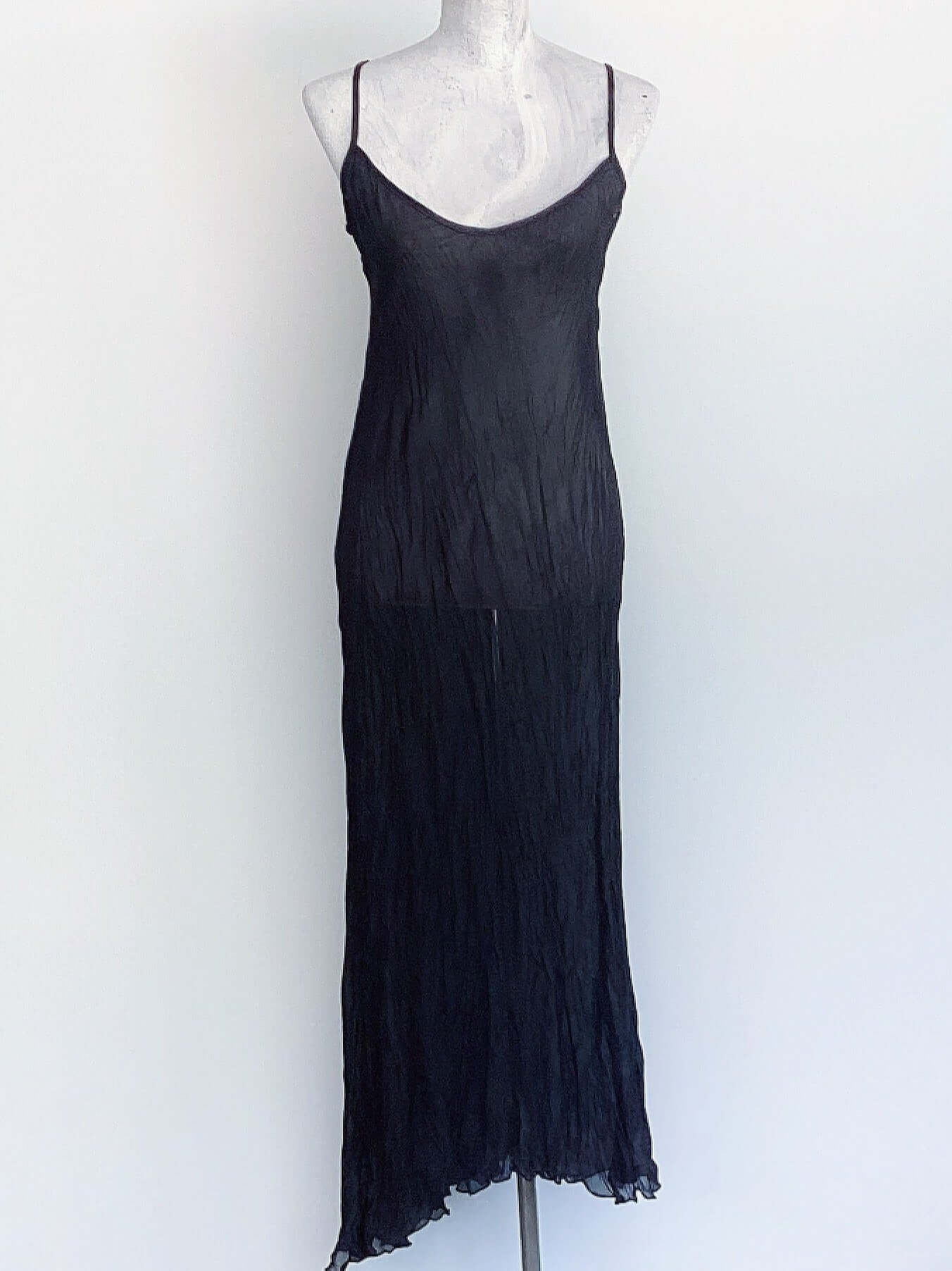 Front of long black sheer chiffon dress, asymmetric hem.