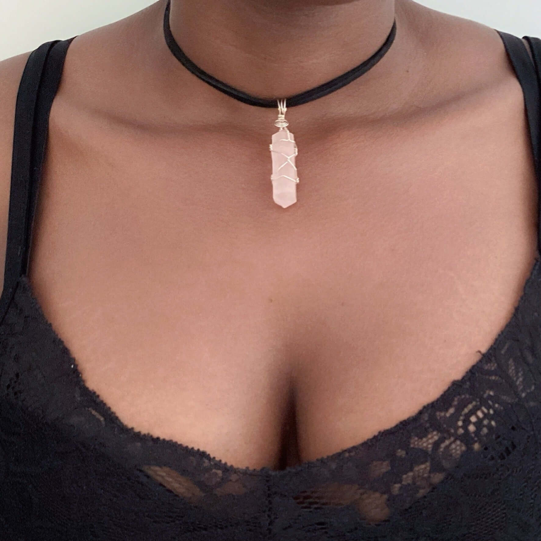 Silver wire bound cut and polished rose quartz on choker.