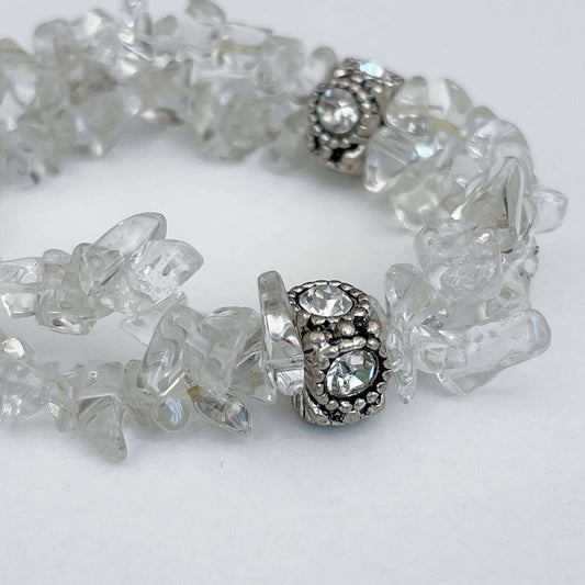 Detail view of double strand tumbled chip bracelet, with a diamante and silver finish bead positioned in 3 places.