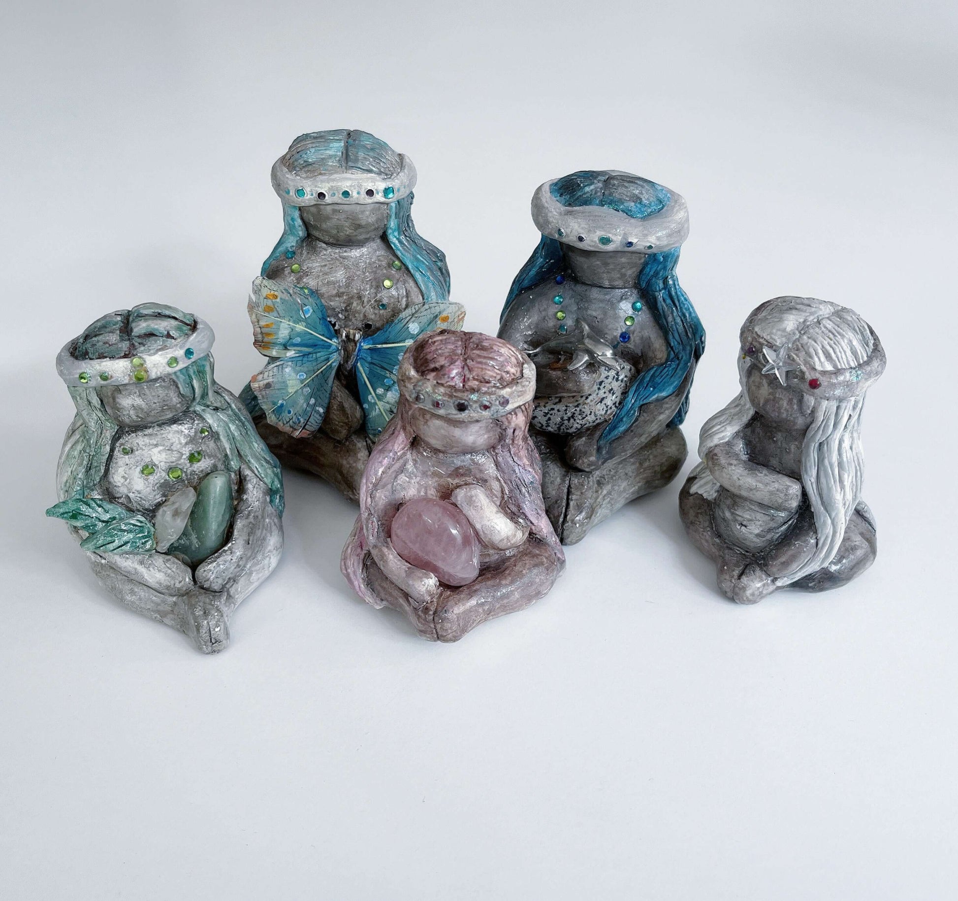 View of five different earth elementals sitting in a group.