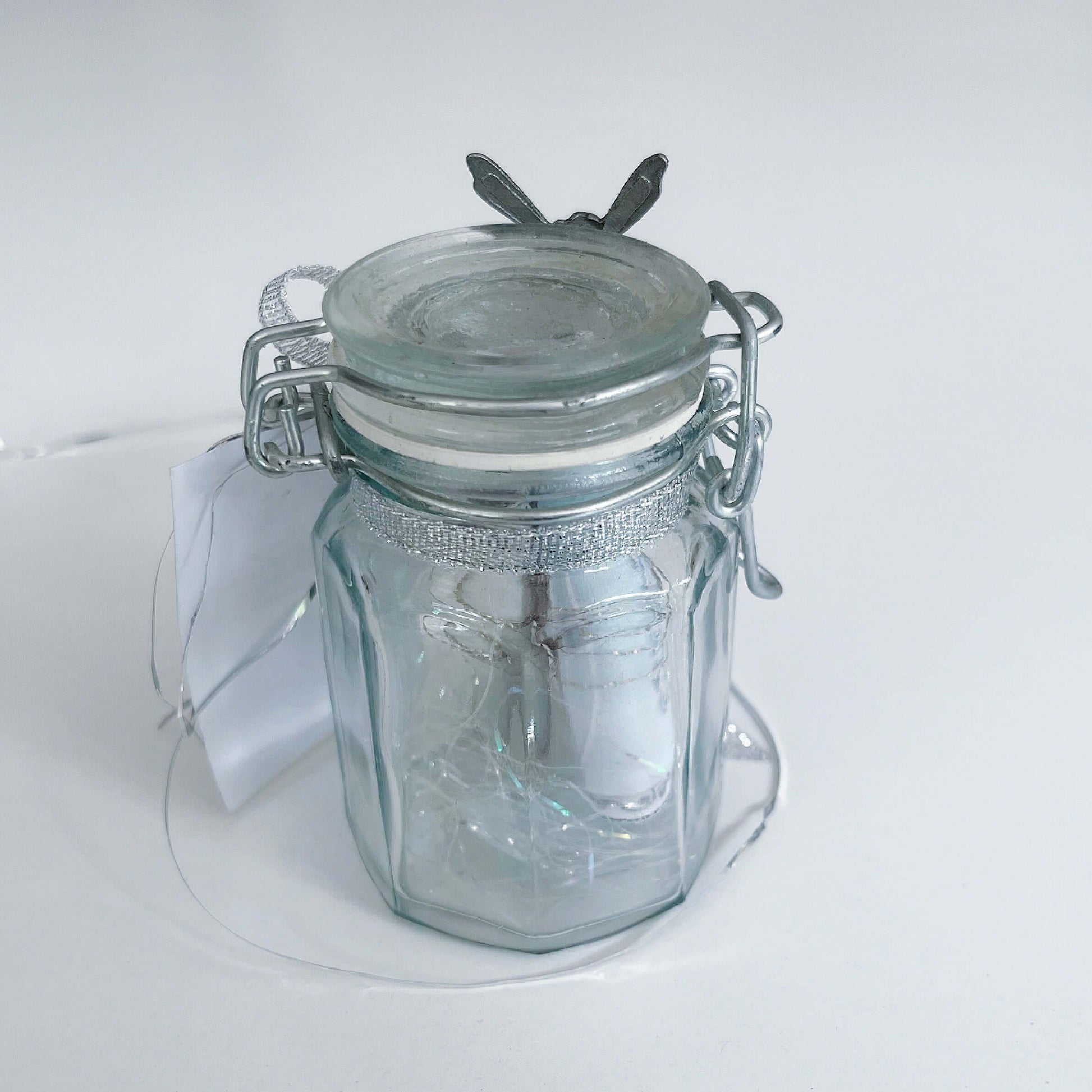 Back view of the bottle, the scrolls visible inside.