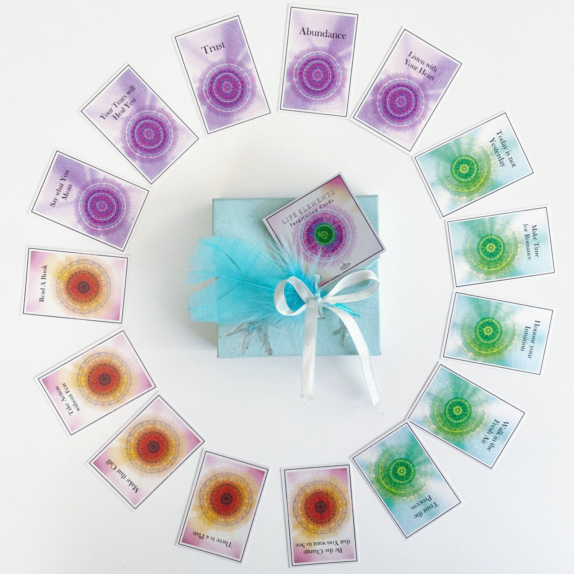 Circular display of the cards, with a packaged complete box set in the center.