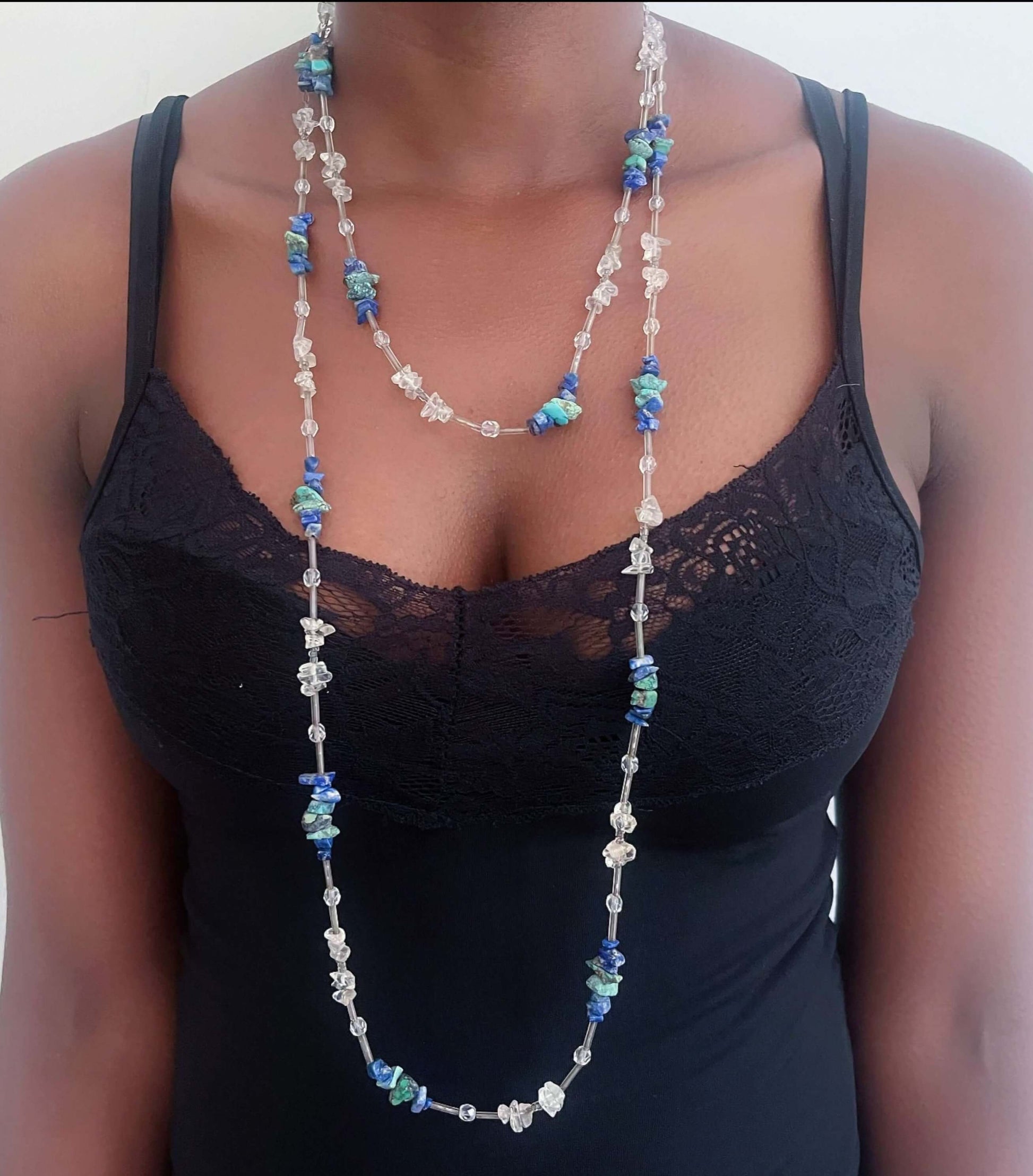 Front view of beaded tumbled clear quartz, lapis lazuli and glass beads, necklace is worn doubled around the neck.