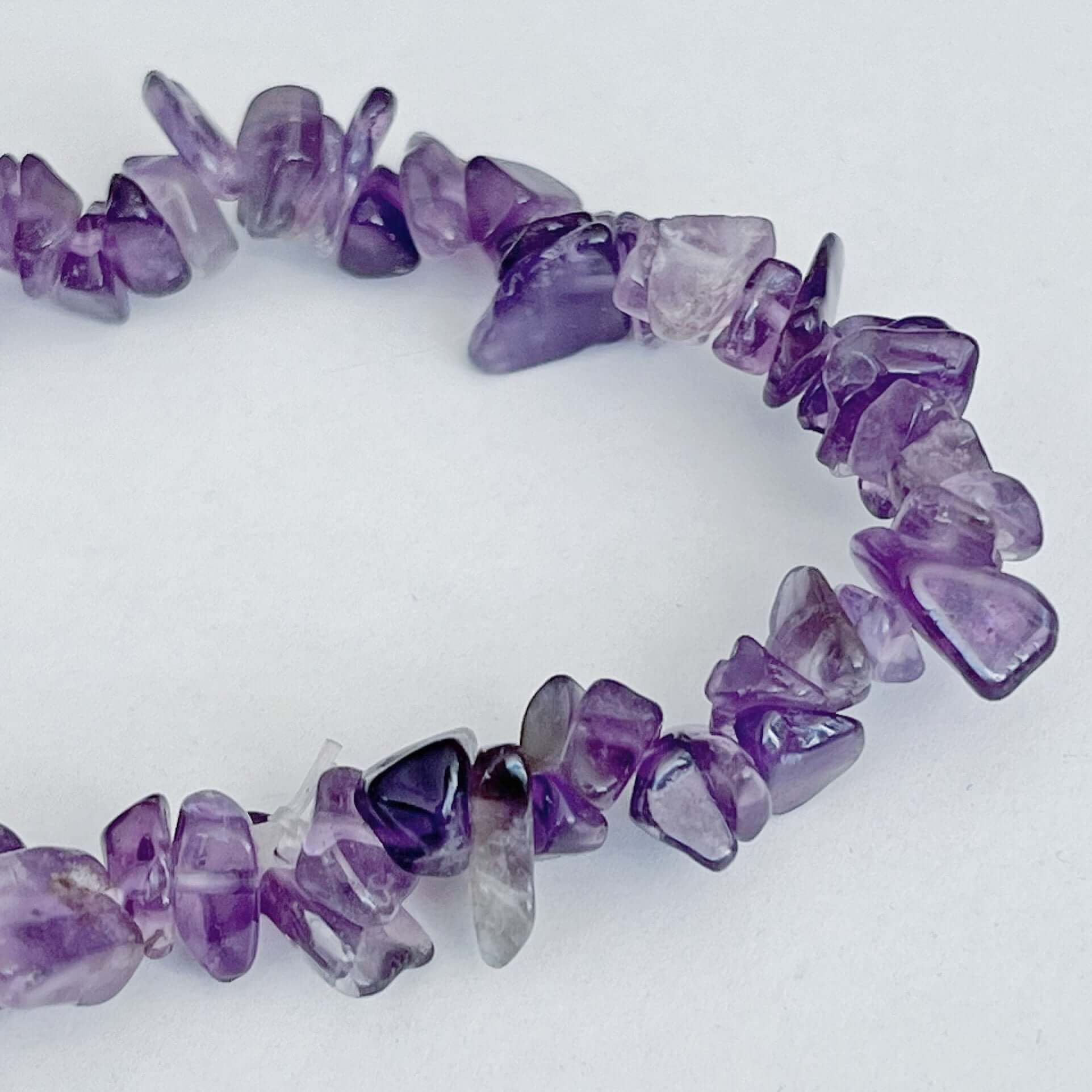 Detail view of the tumbled semi-precious stones, shades of purple.