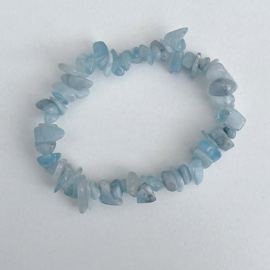 Top view of the tumbled semi-precious stones, shades of aquamarine.