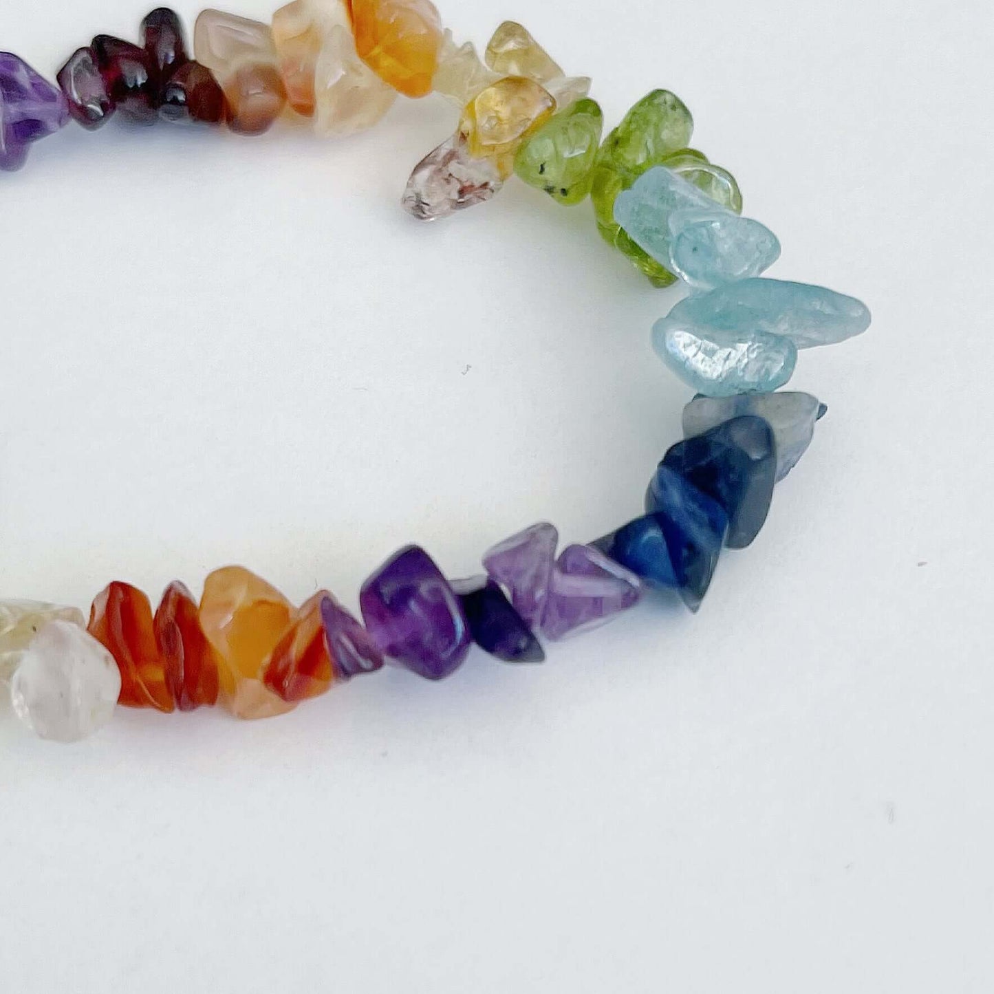 Detail view of the tumbled semi-precious stones, chakra colours.