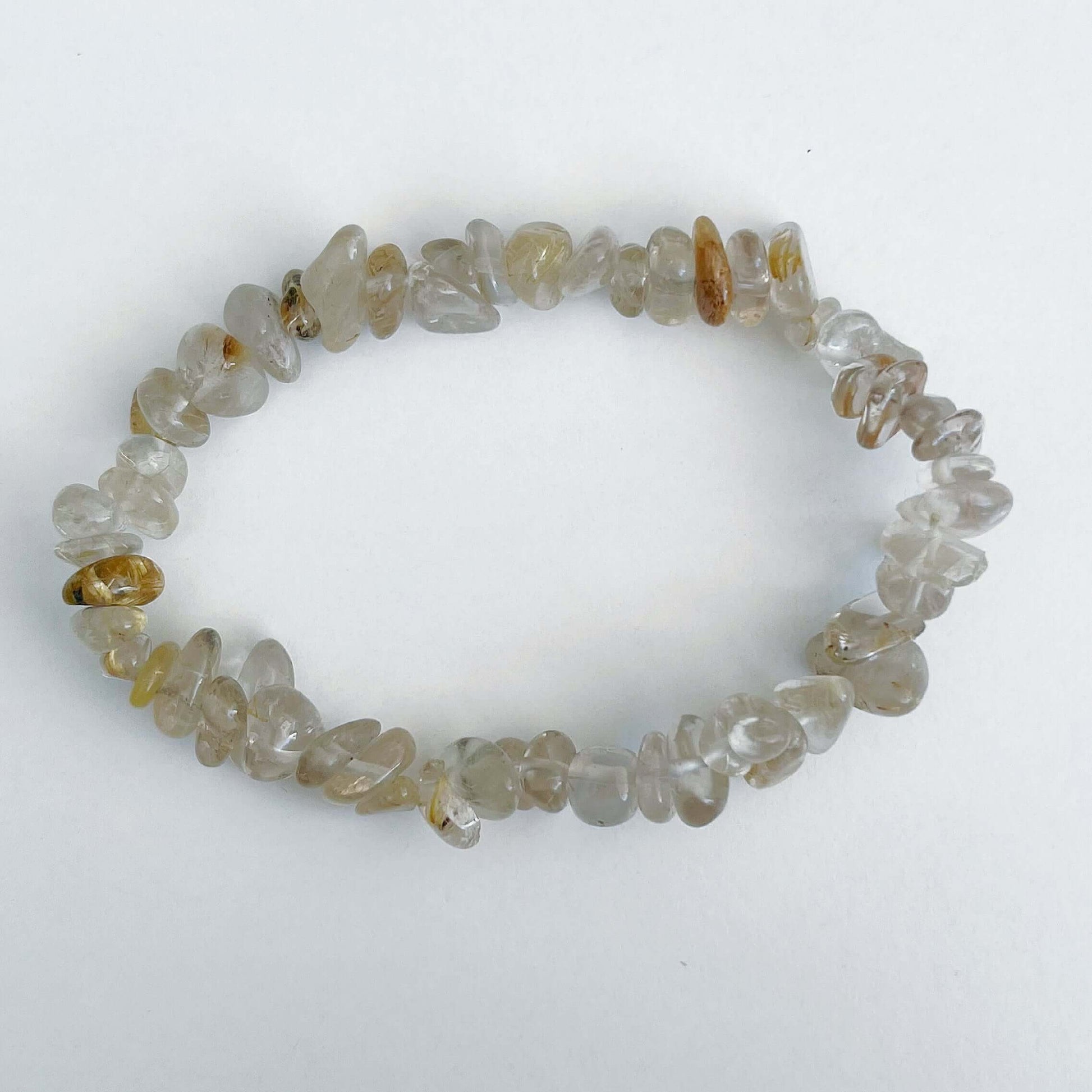 Top view of the tumbled semi-precious stones, clear and light beige.