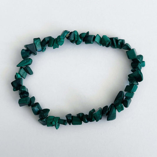 Top view of the tumbled semi-precious stones, shades of deep teal and green.