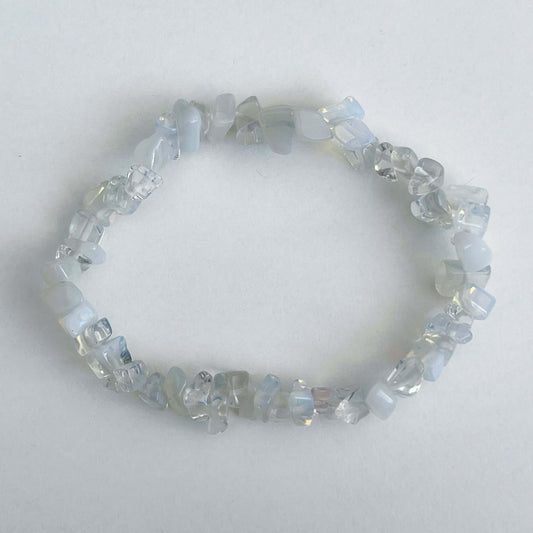 Top view of the tumbled semi-precious stones, shades of clear and white.