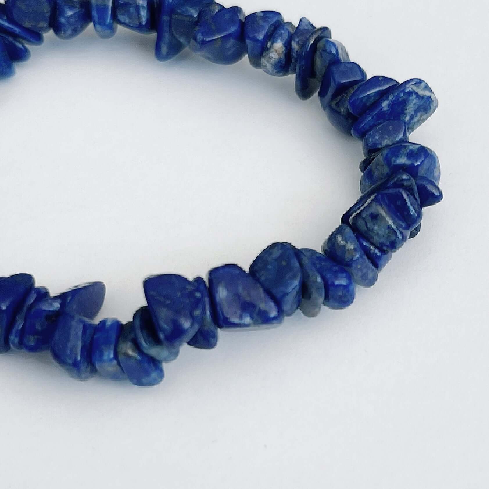 Detail view of the tumbled semi-precious stones, shades of deep royal blue.