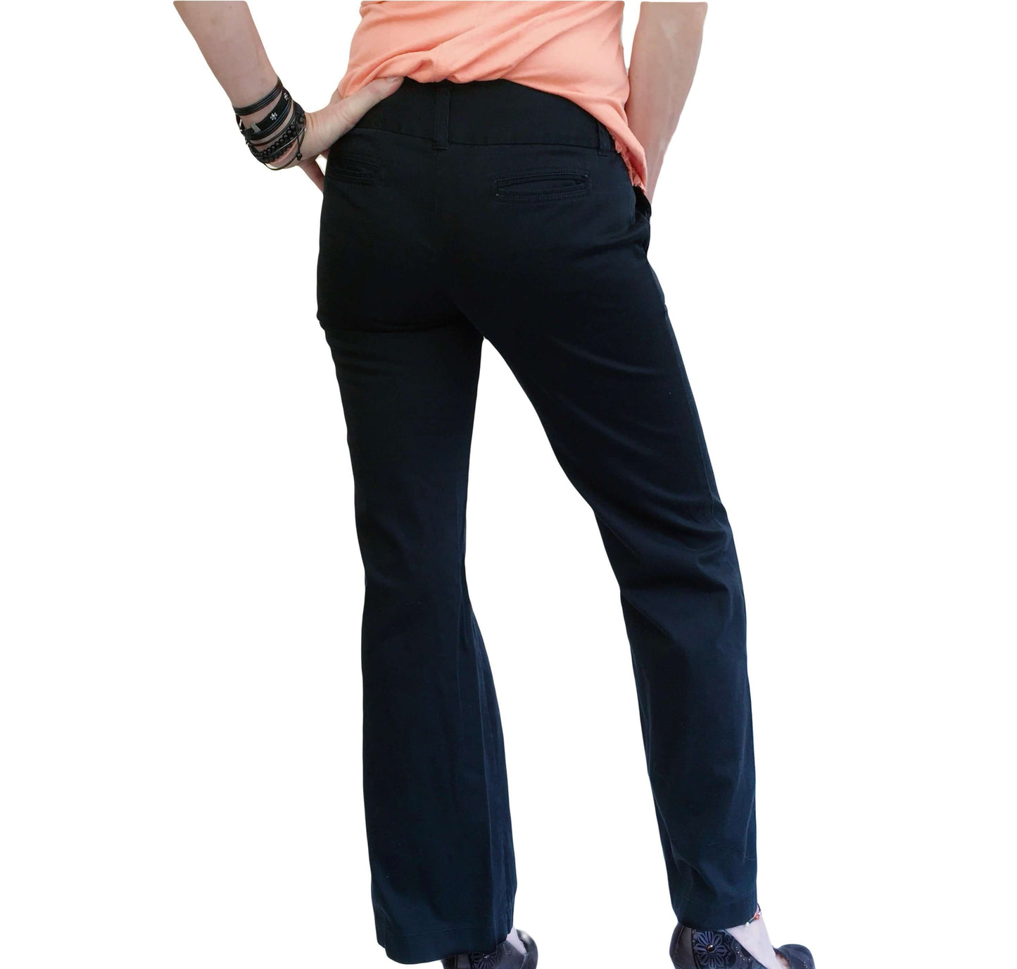 Back view of pants, wide waist band, with loops and two narrow slit pockets.