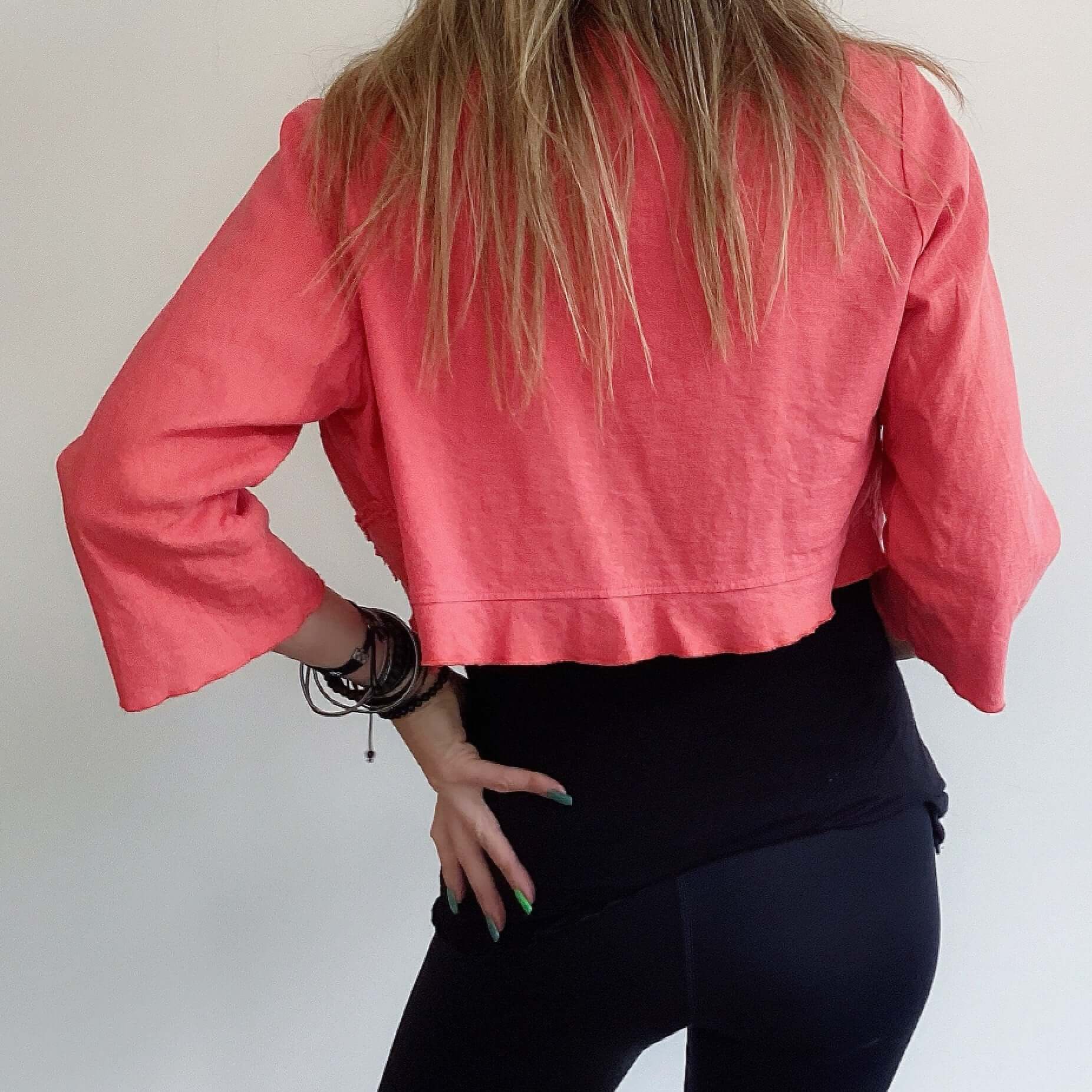 Back view of bolero, slightly flared sleeves.