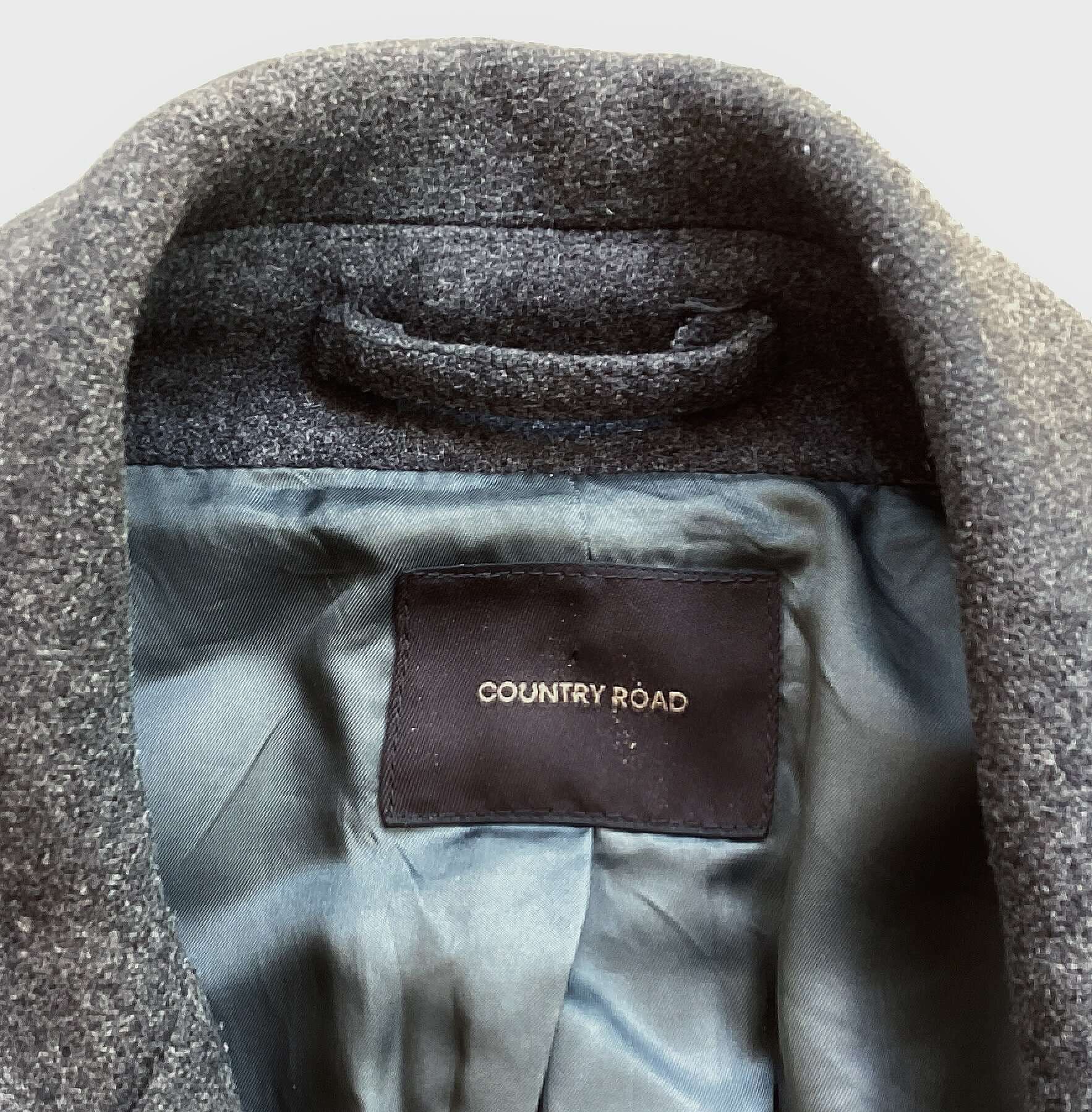 Grey wool formal coat, view of label.