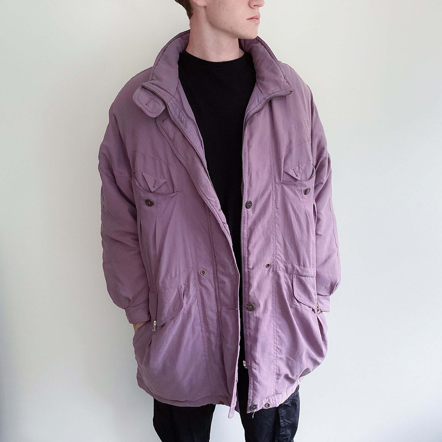 Front view of dusty purple snow jacket, mid thigh length, zipper and buttons.