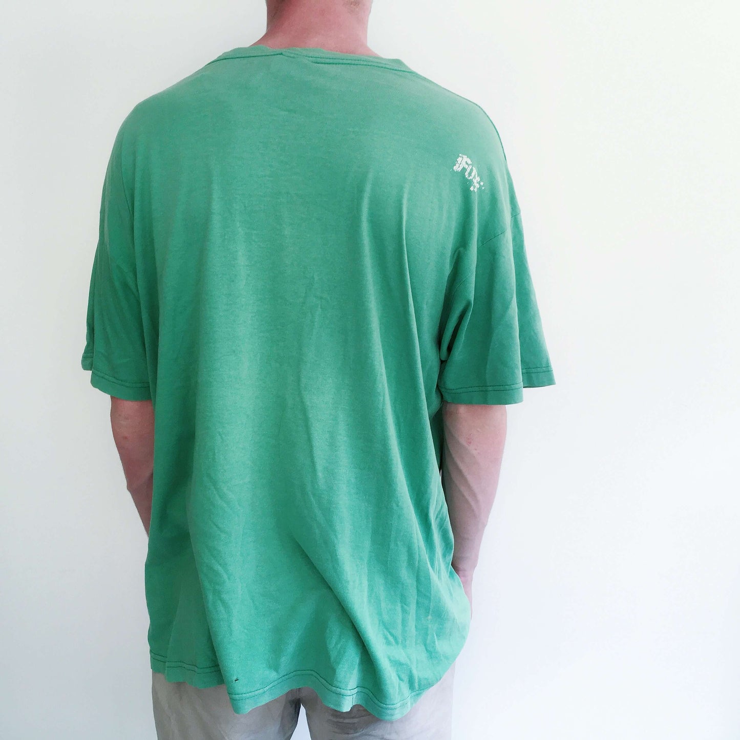 Back view of aqua green drop shoulder tshirt, blank at the back.