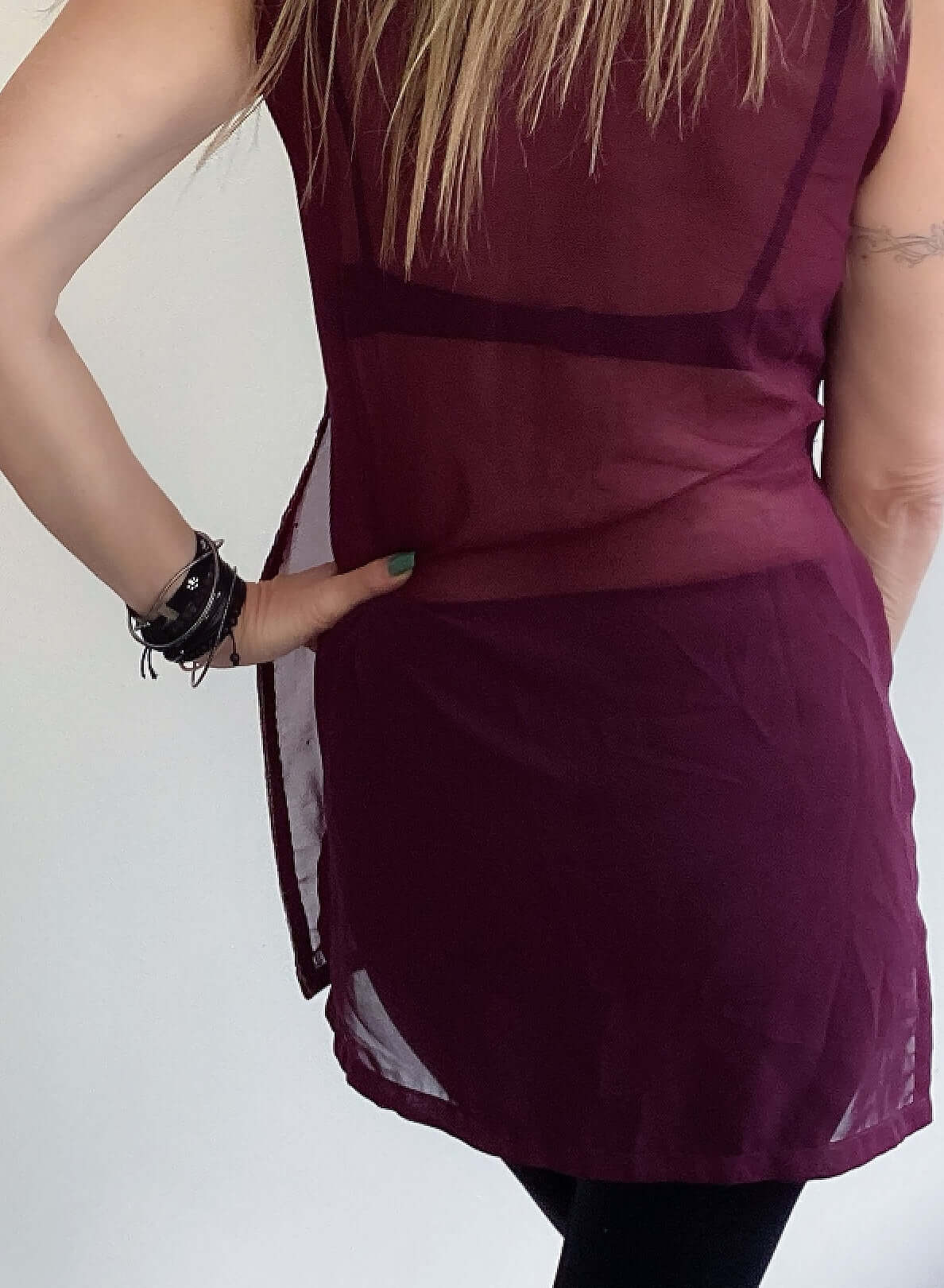 Back view plum tunic, no embroidery, side slits, sleeveless.