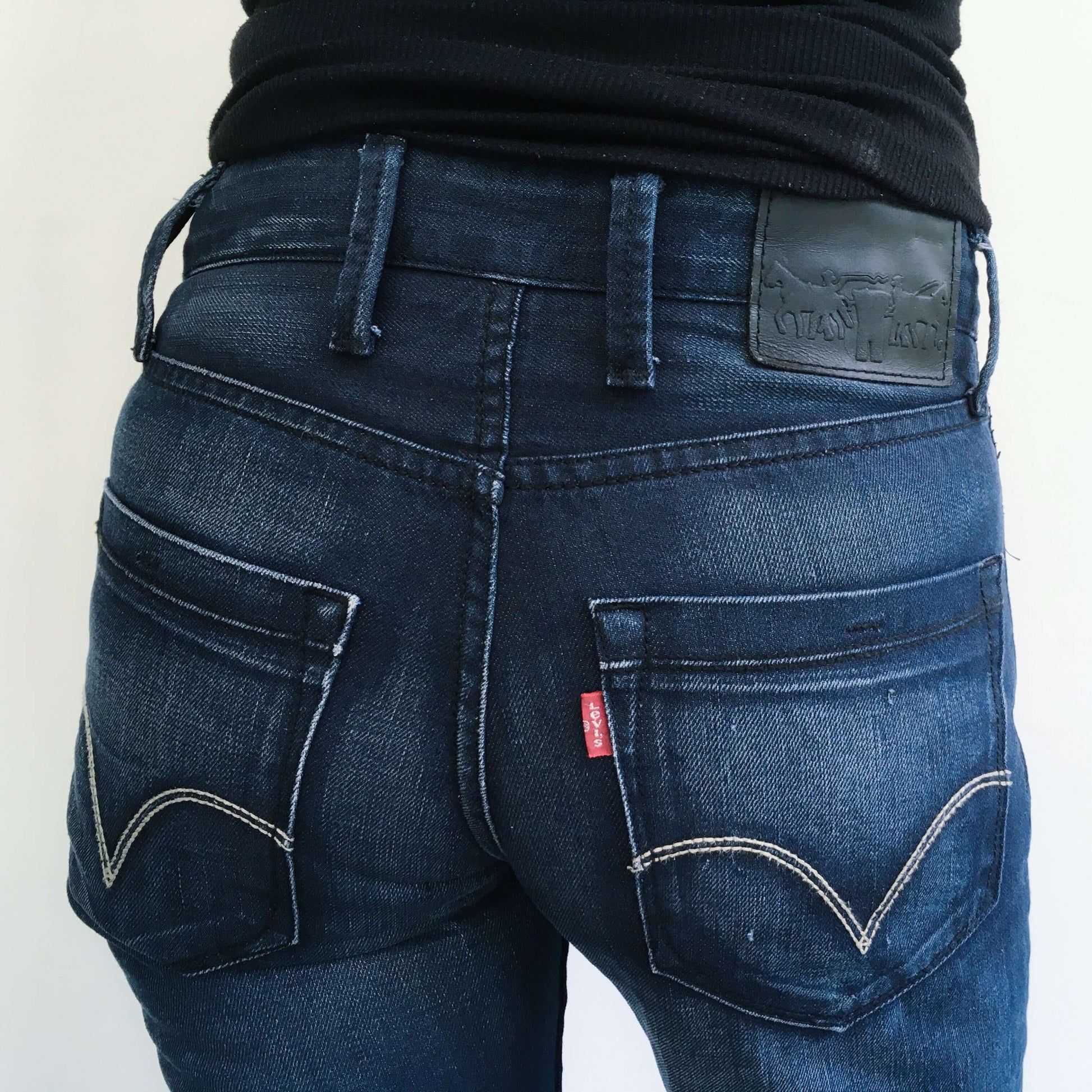 Detail view of back pockets and outside labels.