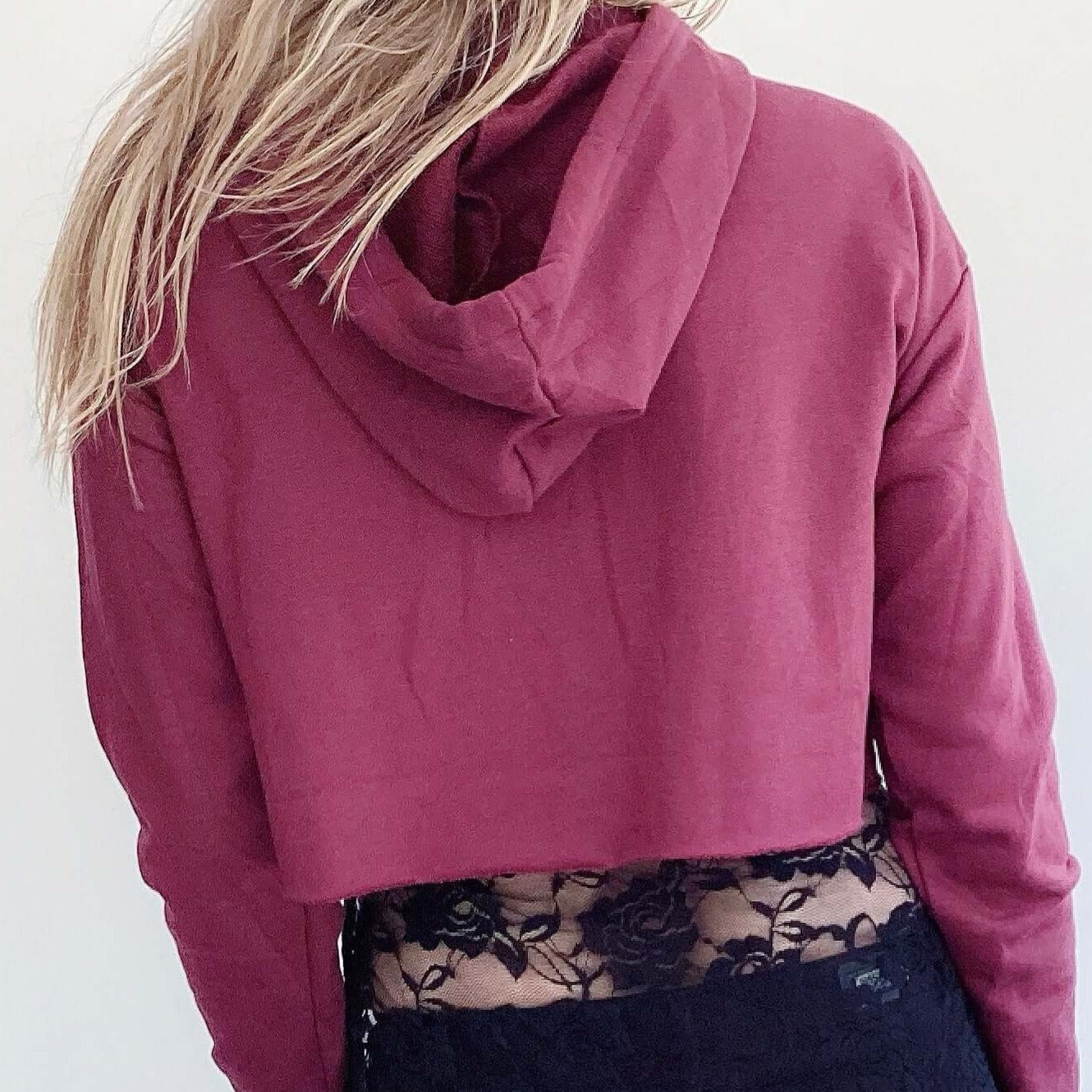 Back view of hoodie, plain maroon color, waist length.