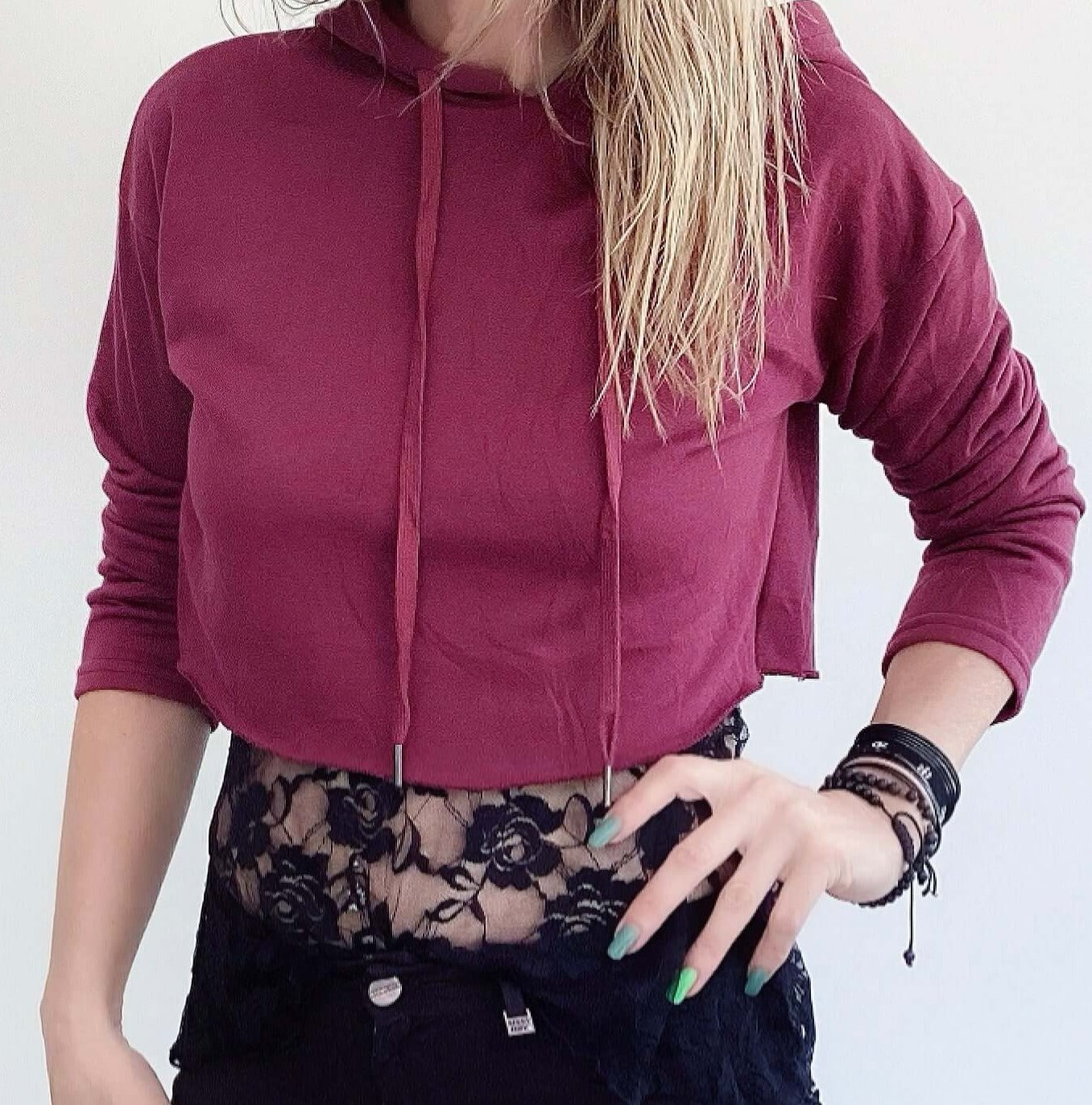 Front view of hoodie, plain maroon color, waist length.