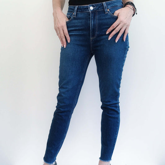 Front view uniform color navy blue jeans.