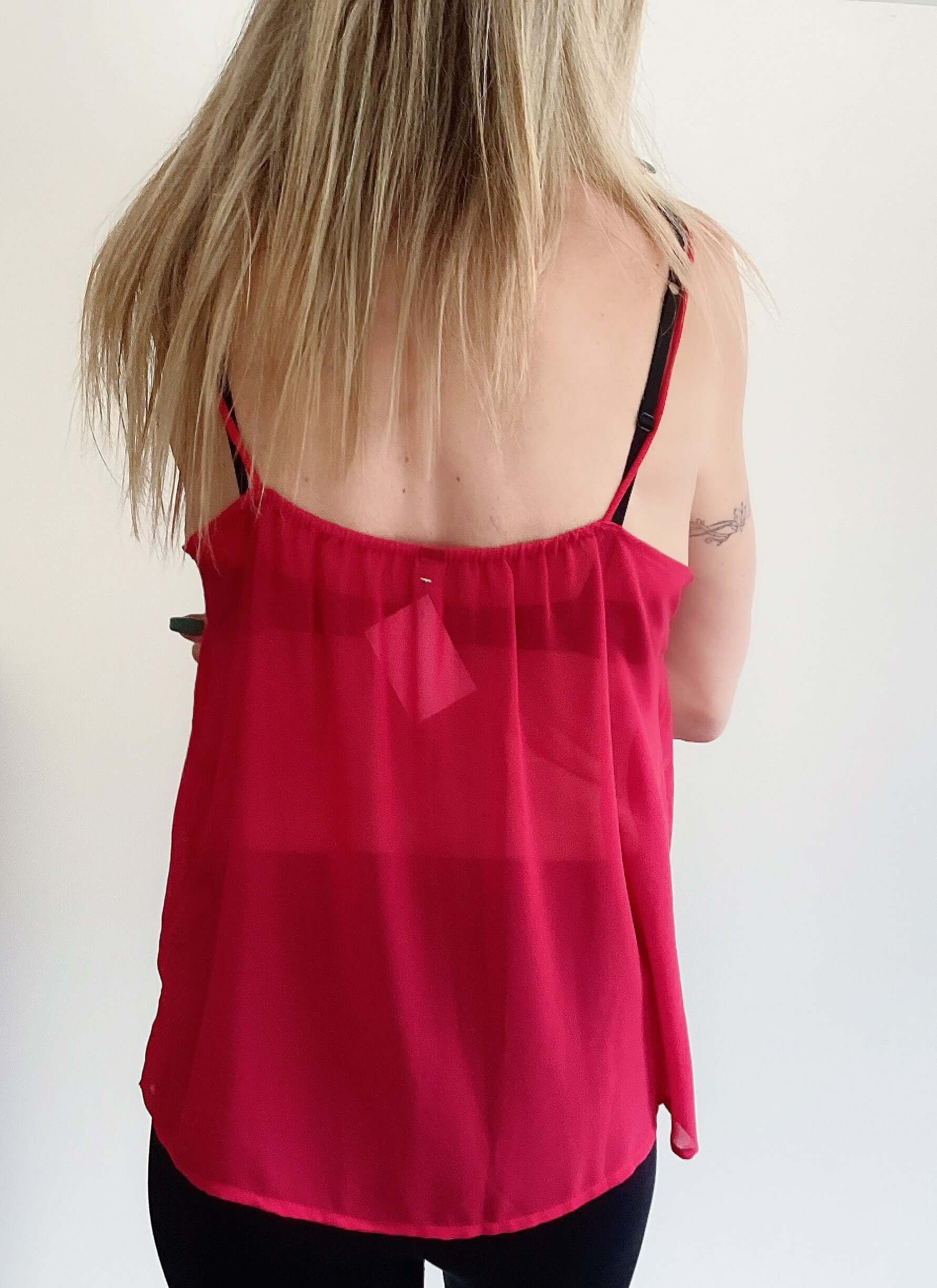 Back view of top, shoe string straps, square neckline, hip length.