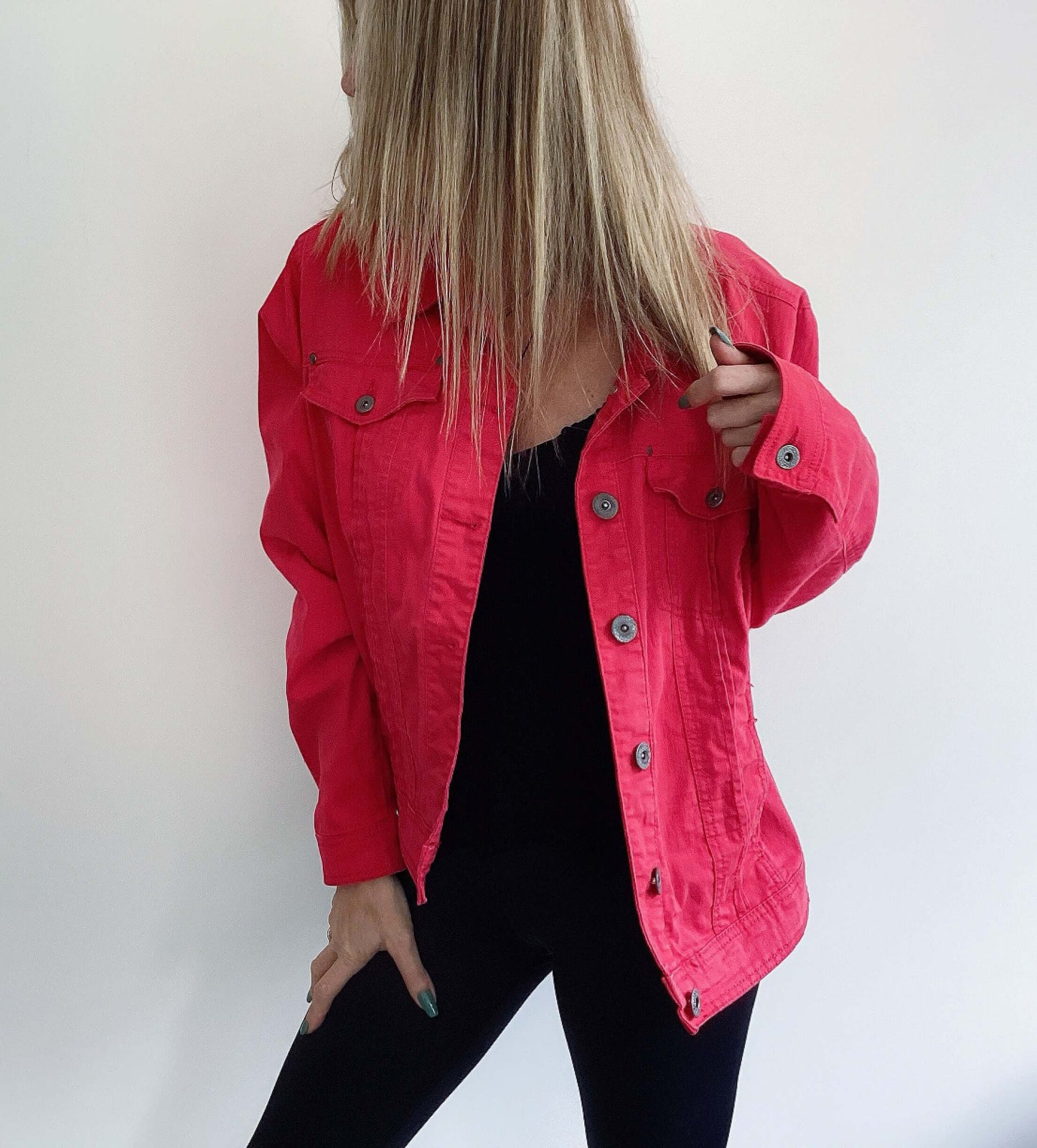 Front view of red denim jacket, hip length.