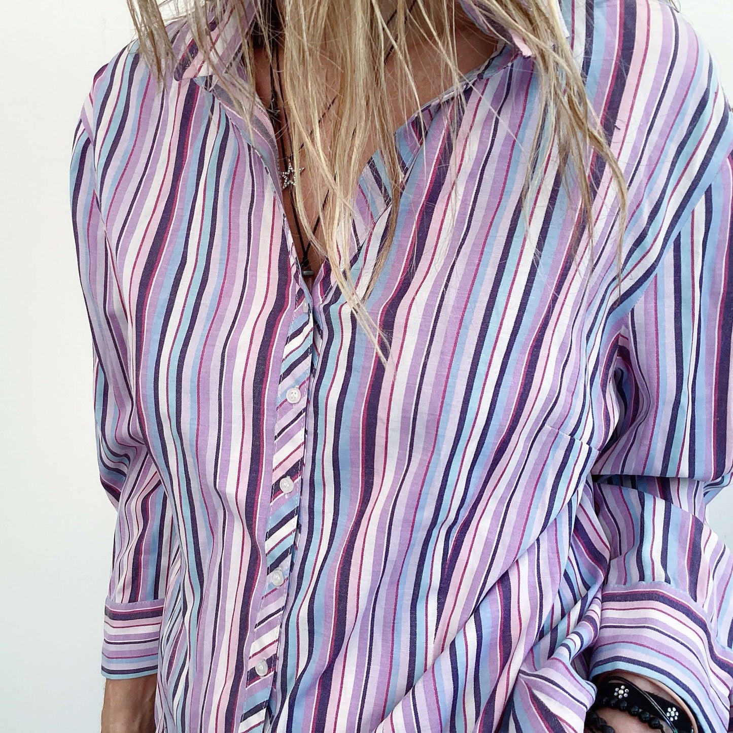 Striped ladies shirt in purple, turquoise and white, button down, detail view.