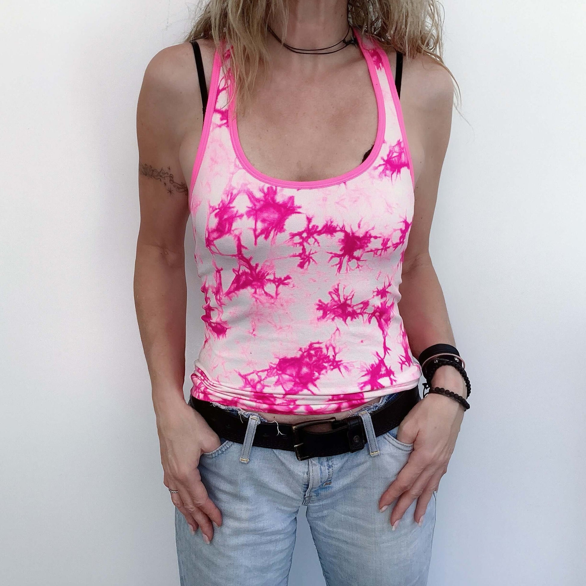 Front view of pink and white tie dyed tank top, tight fit stretch fabric, hip length.