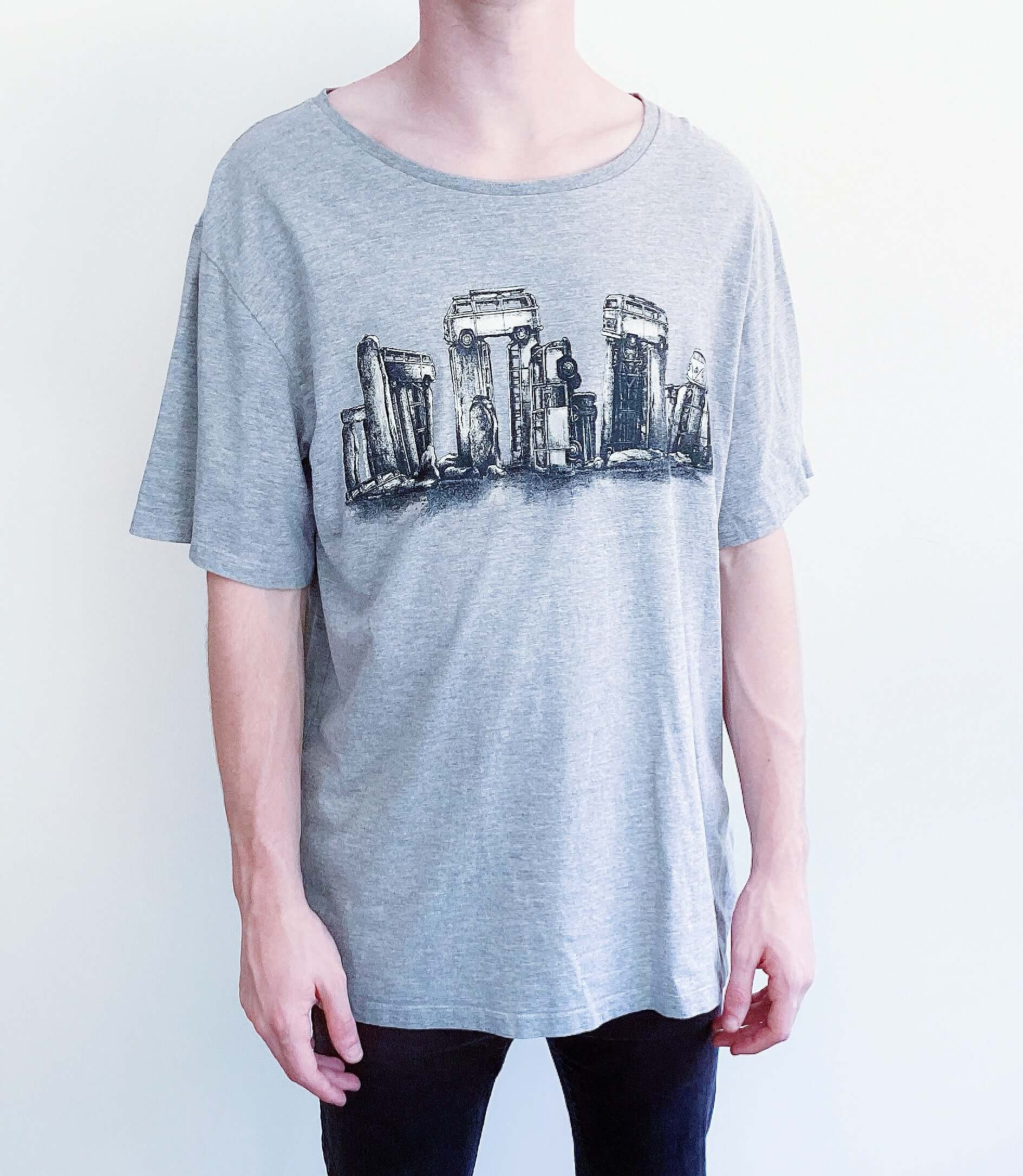 Front view of grey tshirt with vw buses positioned into stonehenge shapes, printed across the chest in black and white.