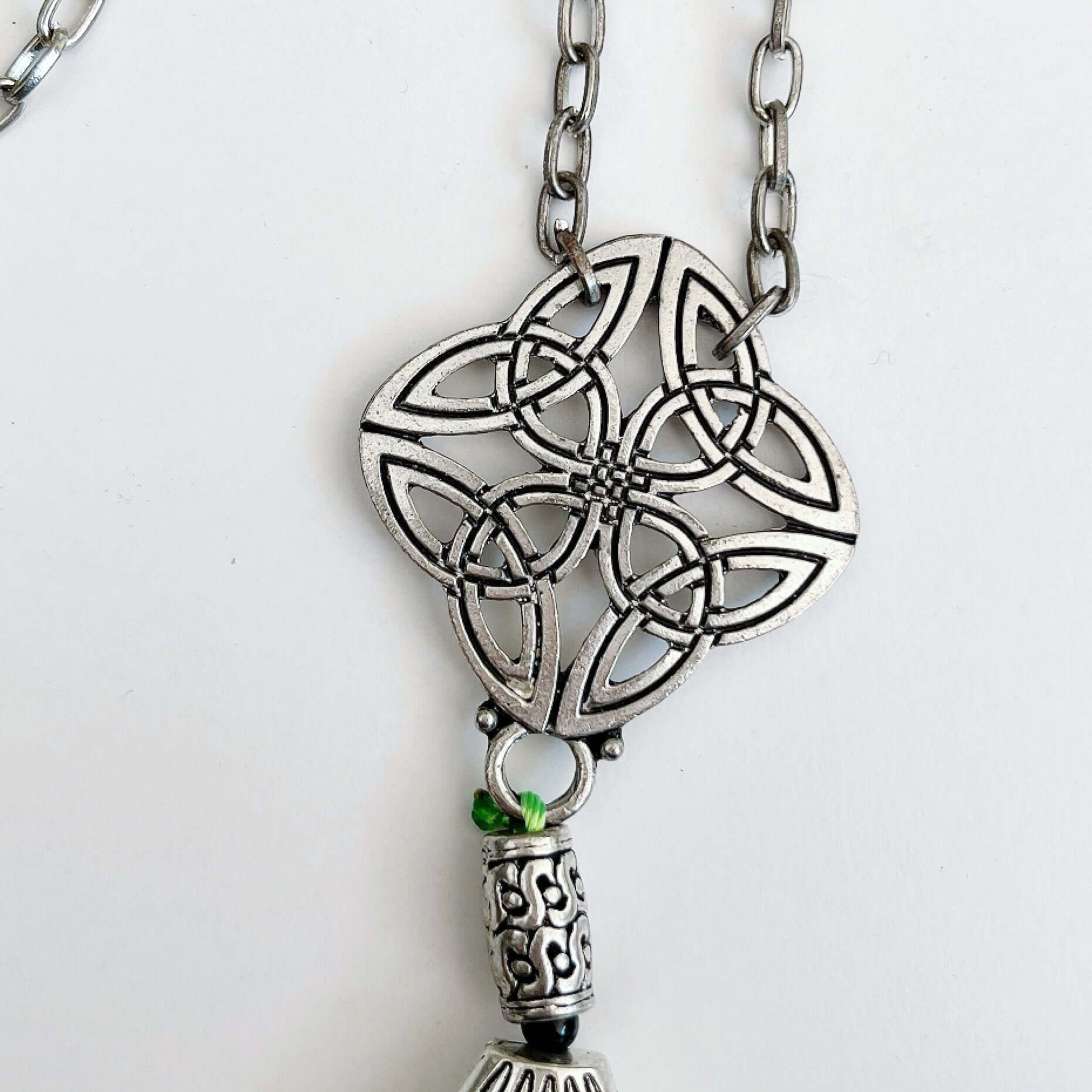 Detail view of the silver finish Celtic pendant.