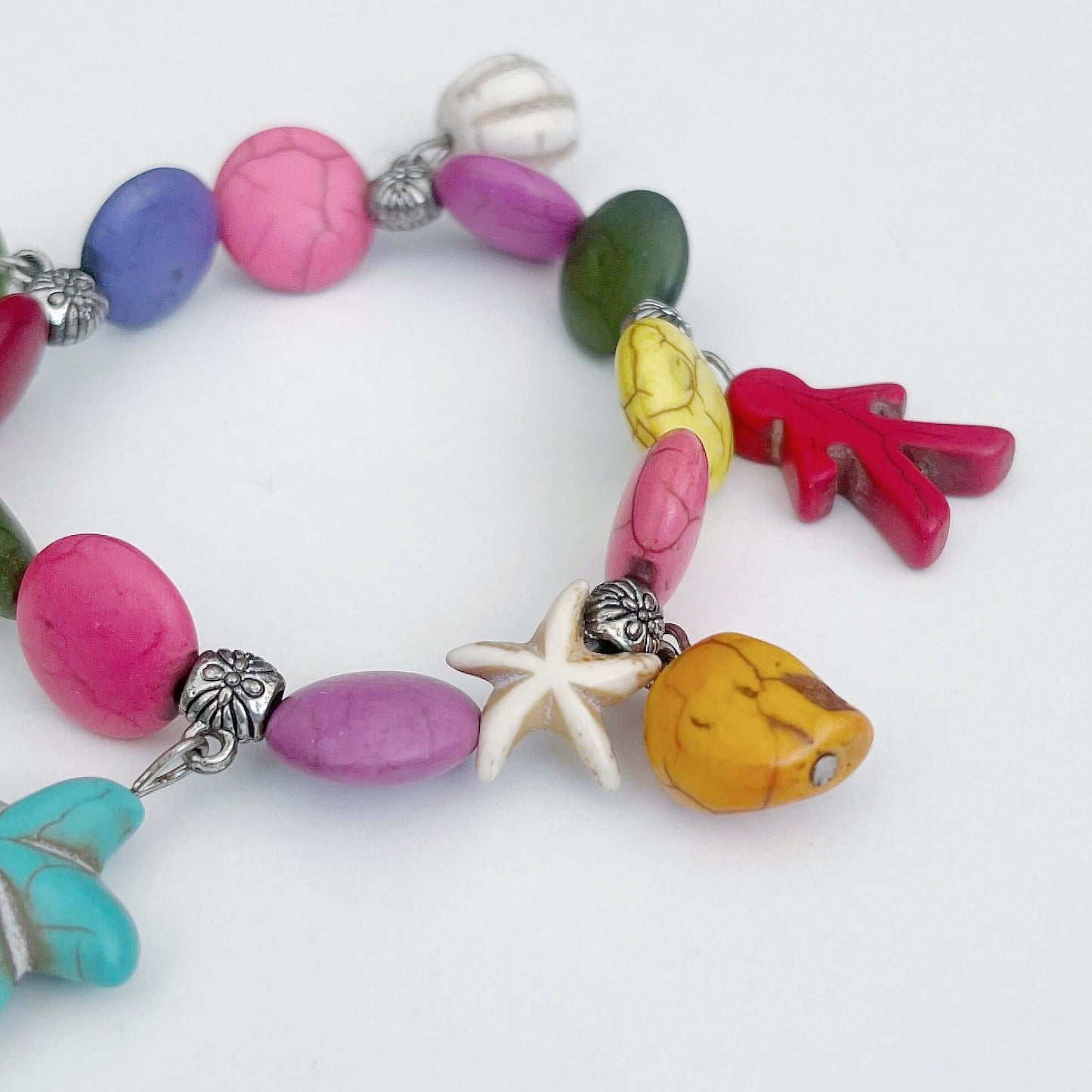 Detail view of the colorful beads and charms.