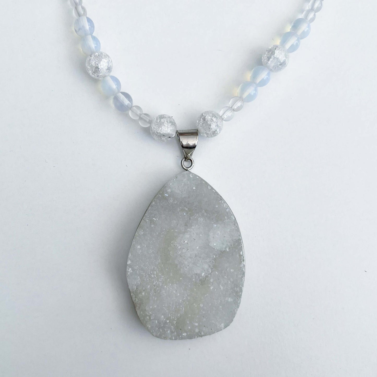 Detail view of the geode pendant. the depth is almost 1cm, delicate crystal on entire surface.